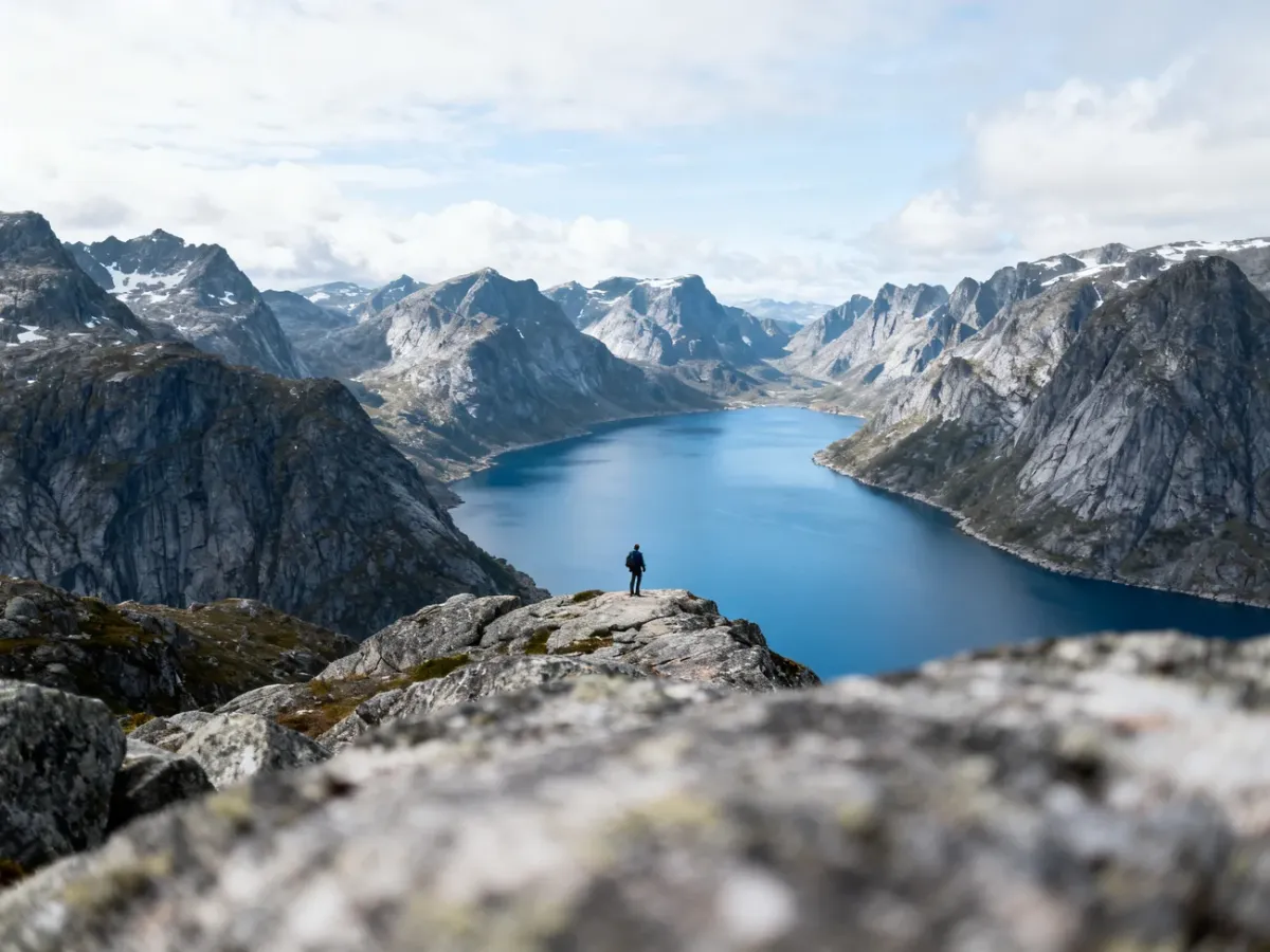 Panoramic view of a Norwegian fjord surrounded by rugged mountains