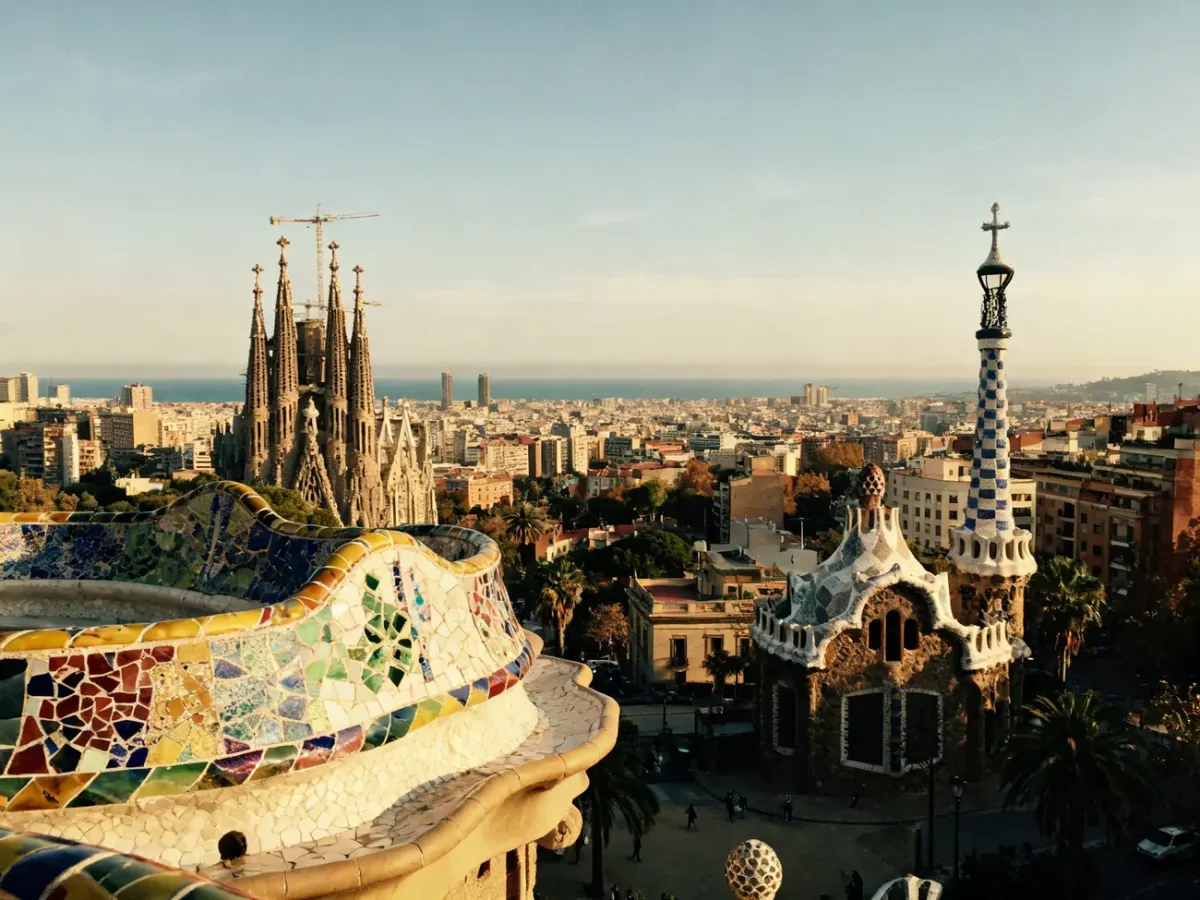 Modernist Barcelona architecture with colorful mosaics and the city skyline